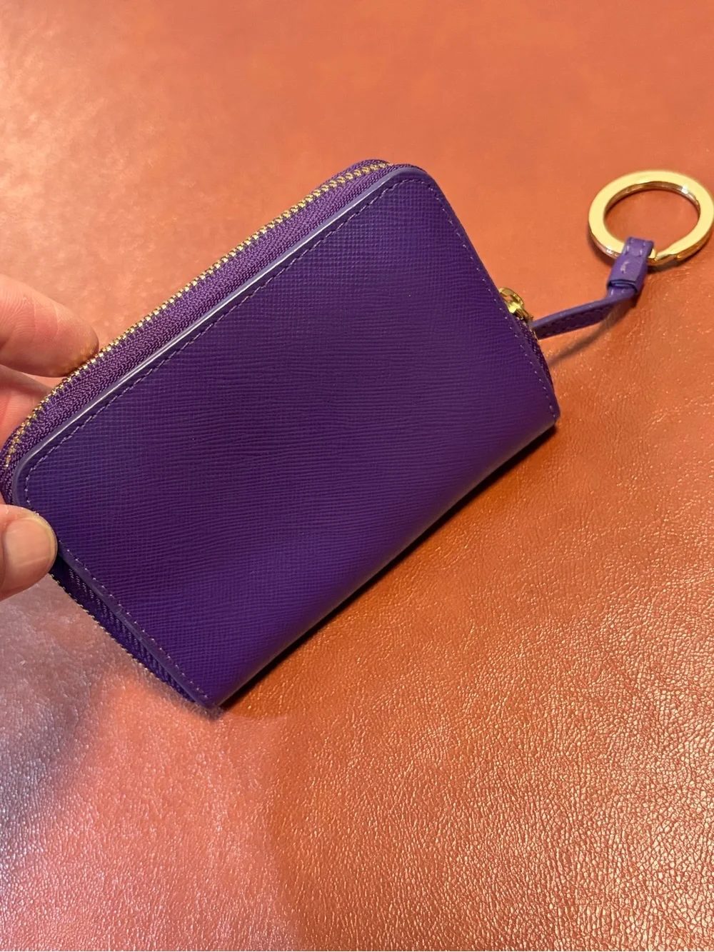 Tory Burch Robinson Saffiano zip-around wallet in a vibrant violet purple New